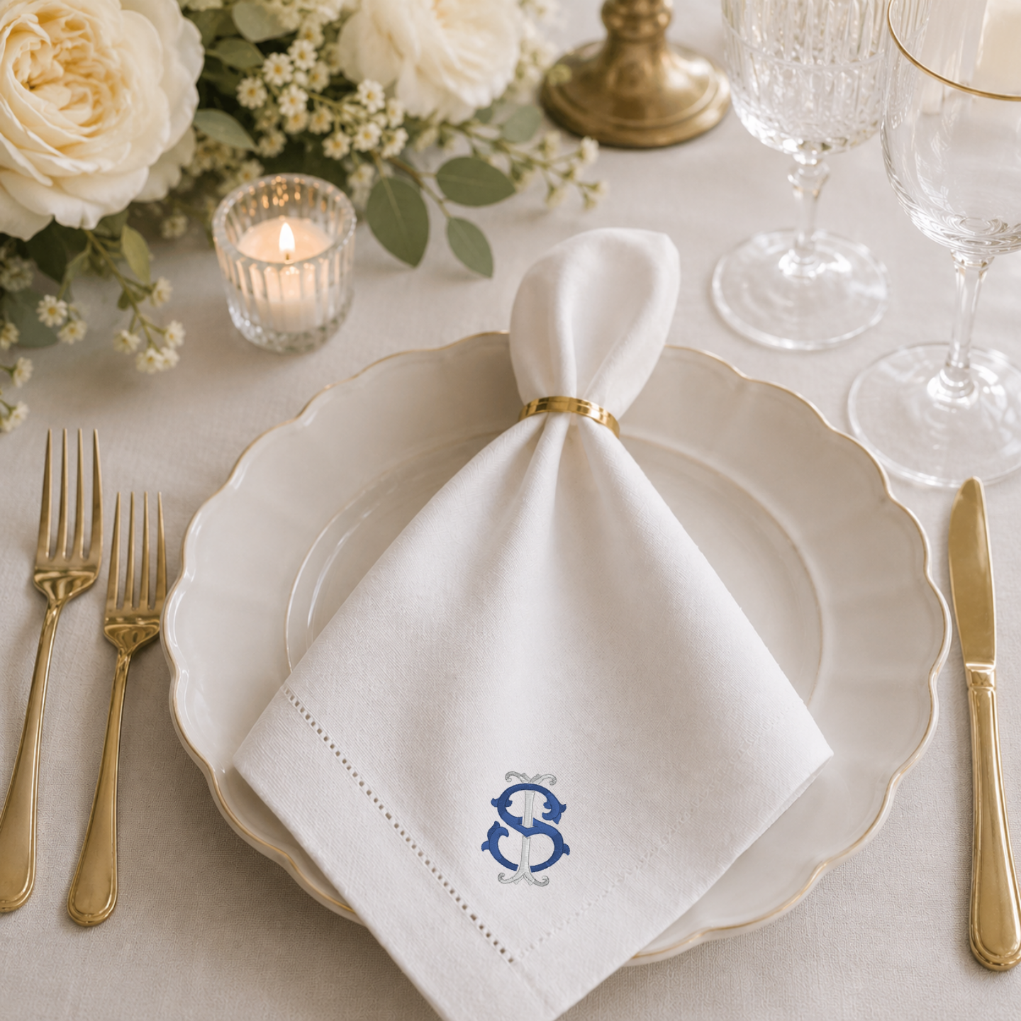 Personalized embroidered napkins on wedding reception table