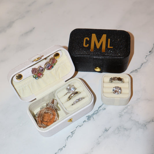 Jewelry boxes with rings on a marble surface