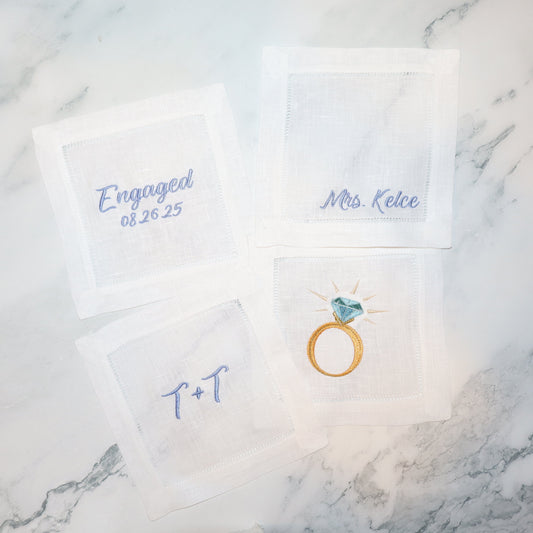 Engagement-themed cards with 'Engaged' and 'Mrs. Katie' text on a marble surface.