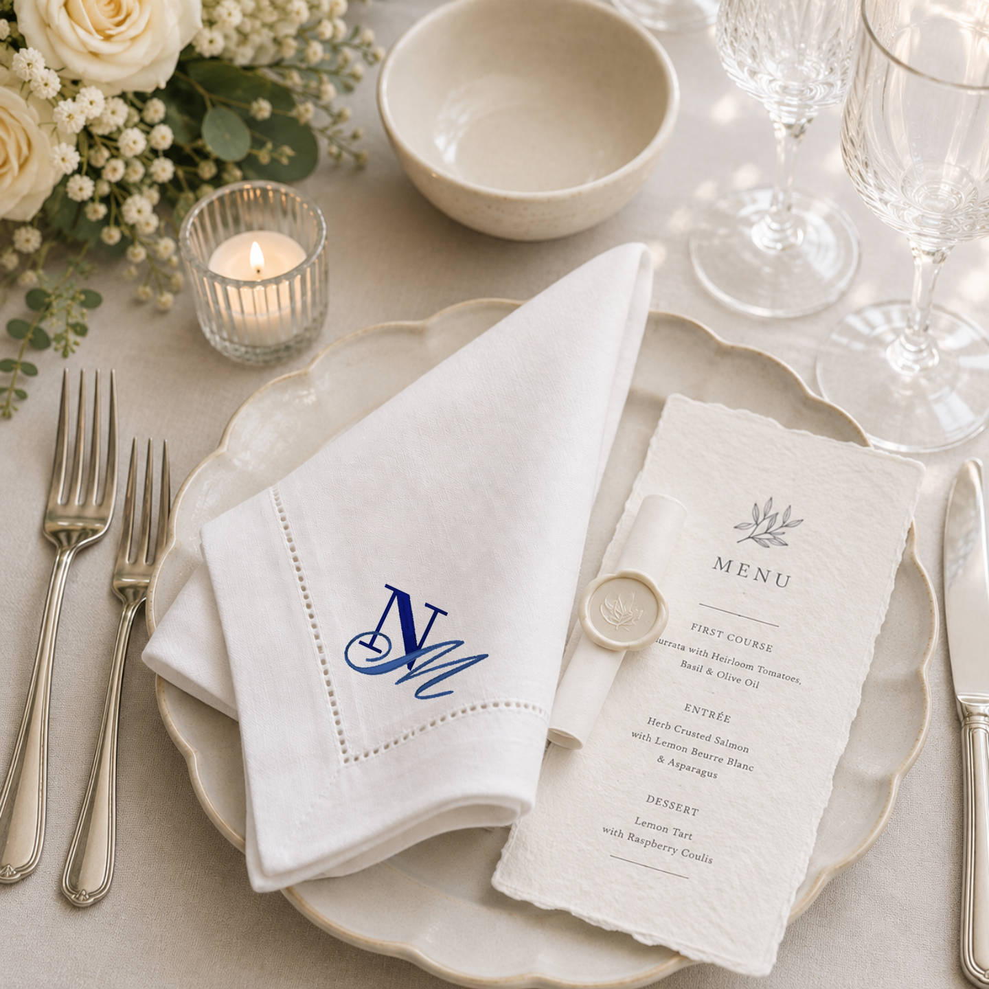 Monogrammed linen table napkins styled for dinner party at home